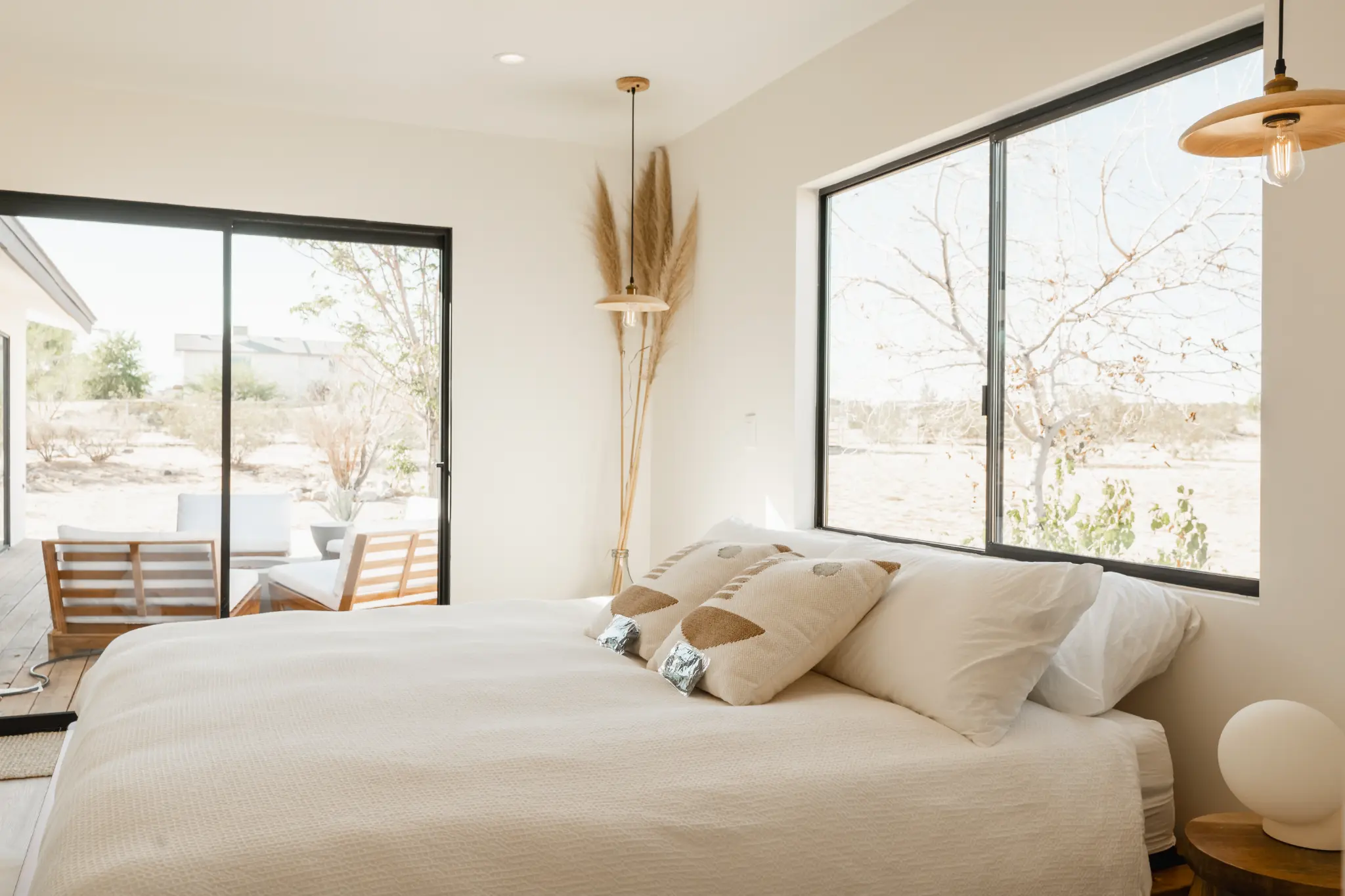 Second bedroom with desert views and linen bedding